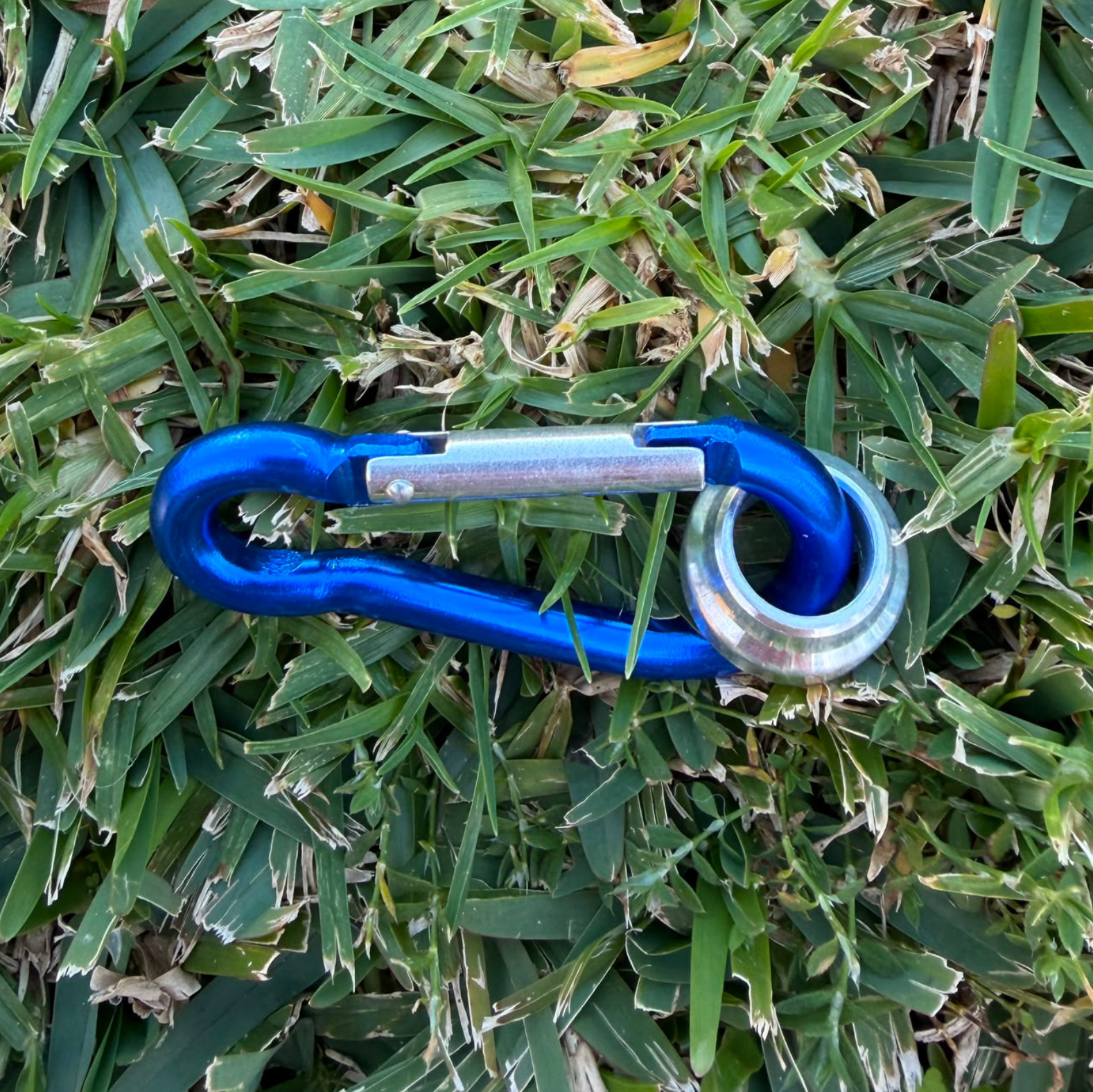 Looplox blue aluminium carabiner accessory with precision-machined metal component.
